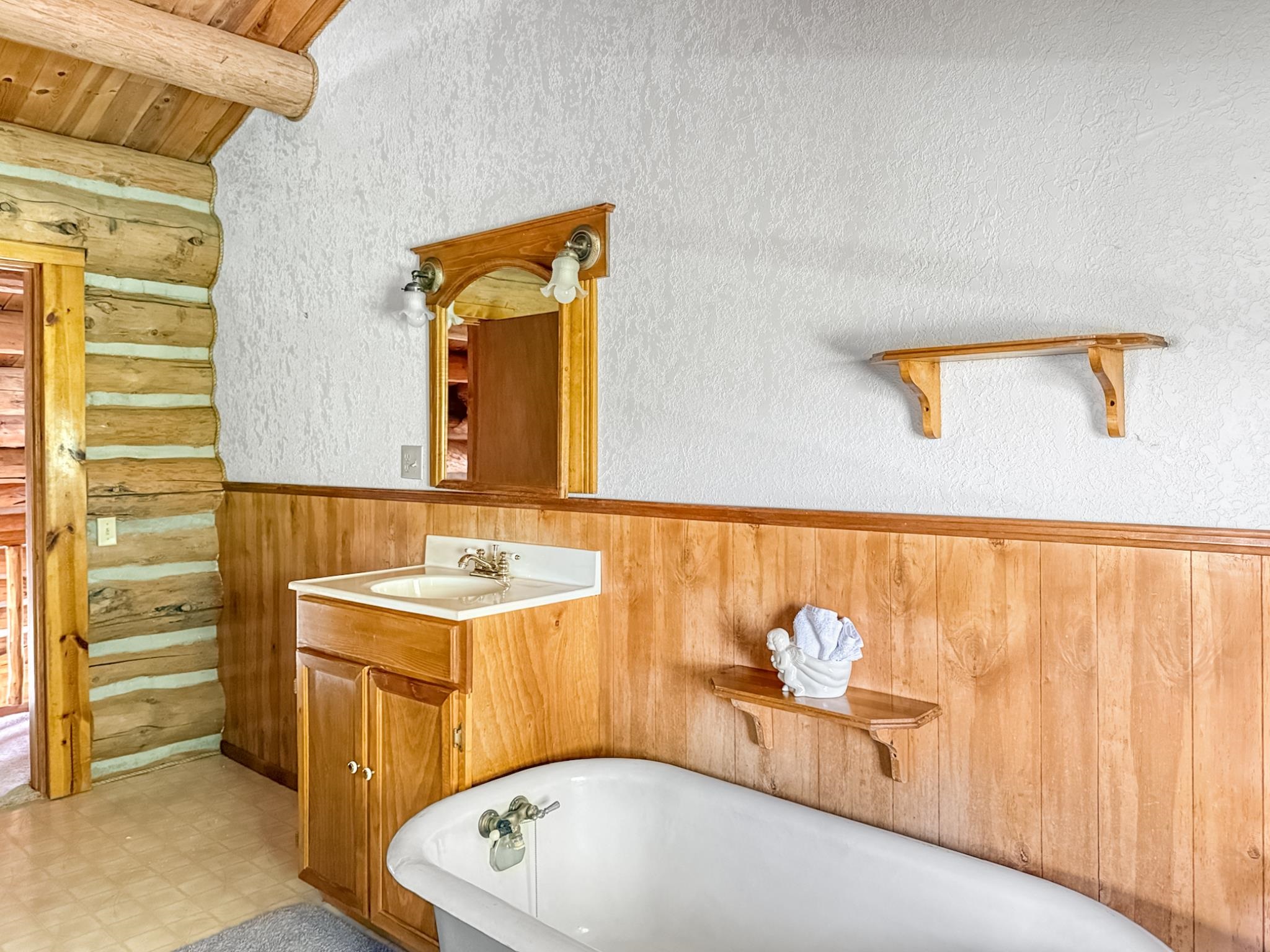 9709 3605 Road Hotchkiss, CO 81419 - Photo 11 of 42 a bathroom with a sink and a bathtub