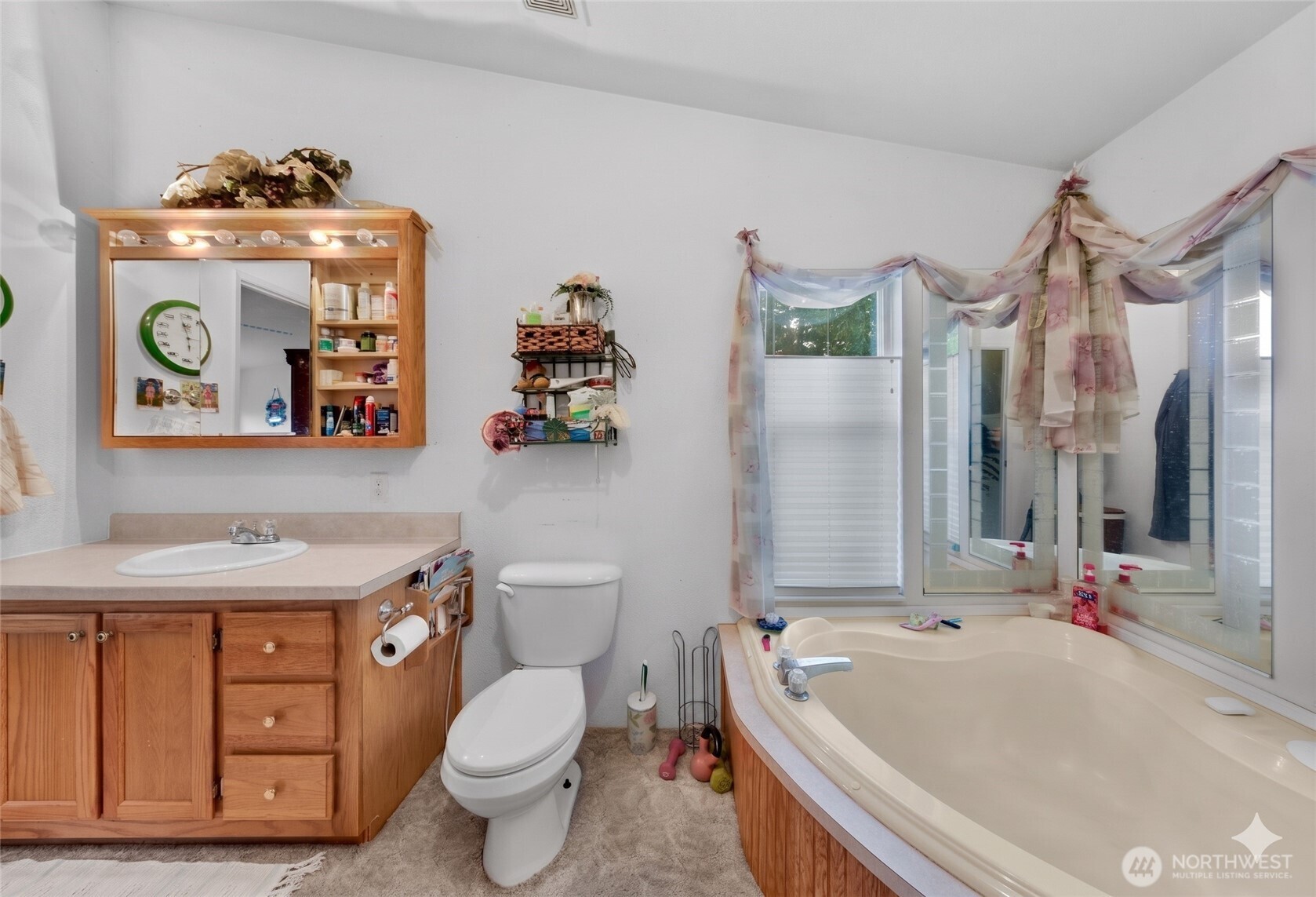 7928 Portal Way Custer, WA 98240 - Photo 22 of 39 a bathroom with a sink a toilet and shower curtain