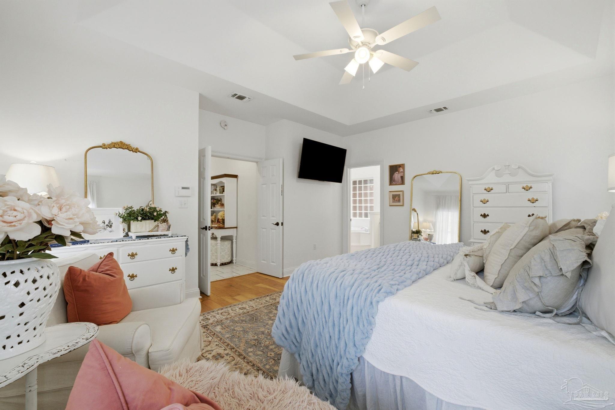 5931 Otter Point Road Pensacola, FL 32504 - Photo 34 of 67 a bedroom with a large bed and a flat screen tv