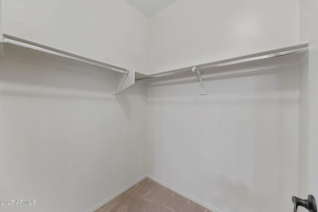 a bedroom with a bed and flat screen tv