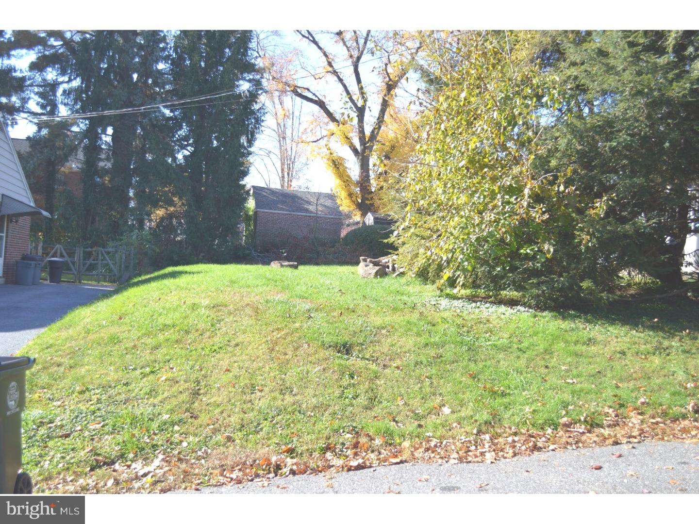 L150 Pine Road Wallingford, PA 19086 - Photo 3 of 5 a view of yard with tree in the background