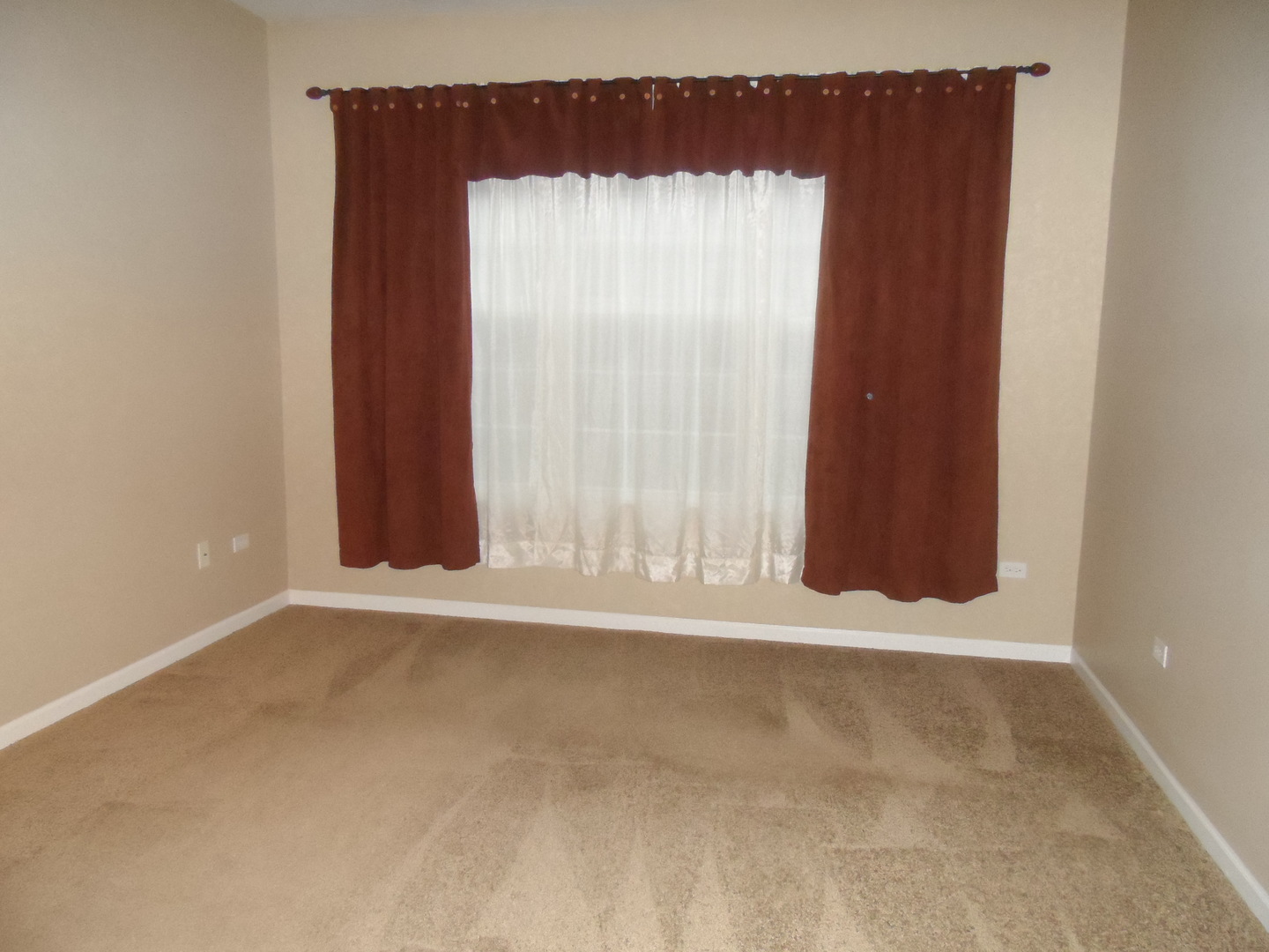 13691 Hemlock Road Huntley, IL 60142 - Photo 6 of 12 an empty room with wooden floor and windows