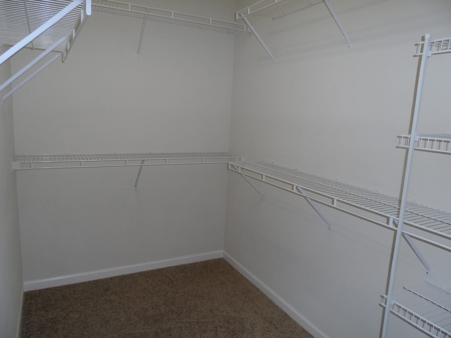 13691 Hemlock Road Huntley, IL 60142 - Photo 8 of 12 a view of a room with racks on the wall