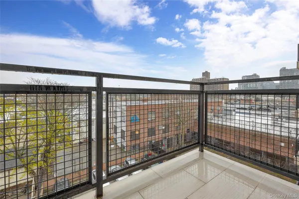 a view of a balcony with a floor to ceiling window