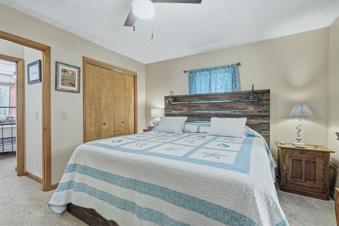 211 Cedar Ridge Drive Westminster, SC 29693 - Photo 15 of 34 Warm wood doors and soft carpet ground this inviting, comfortable bedroom retreat.