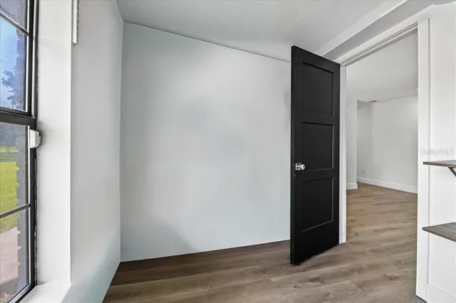 a front view of a house with a garden and yard