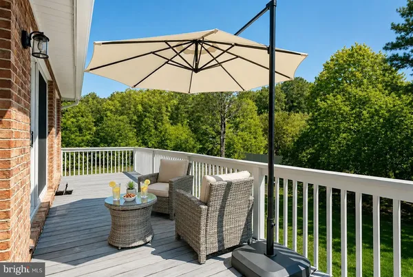 a view of a chair and table in the balcony