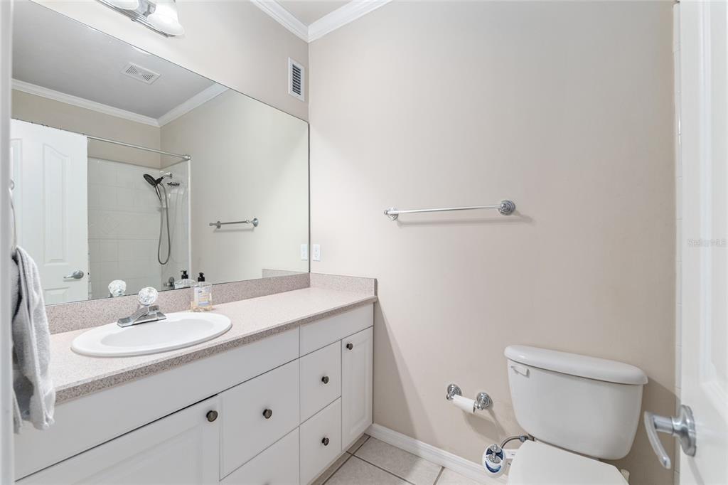 10614 Southwest 15th Lane Gainesville, FL 32607 - Photo 50 of 85 a bathroom with a sink a toilet and a mirror