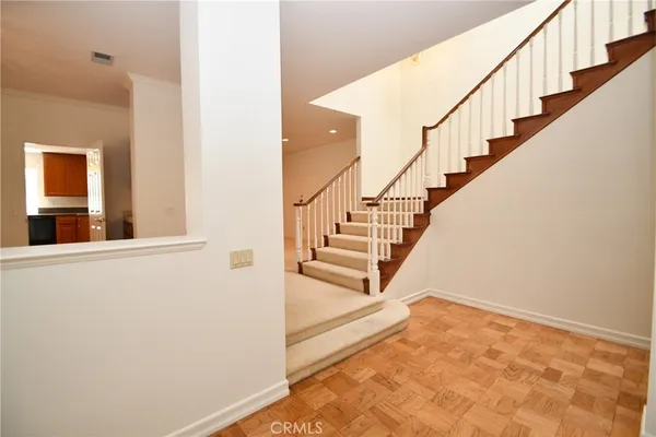 a kitchen with granite countertop cabinets stainless steel appliances a sink and window
