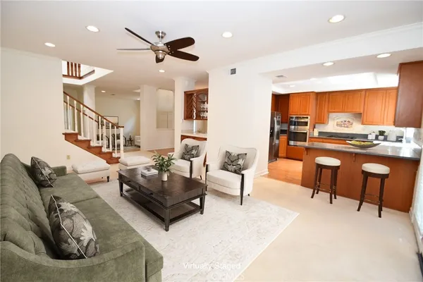 a view of kitchen with furniture and a ceiling fan