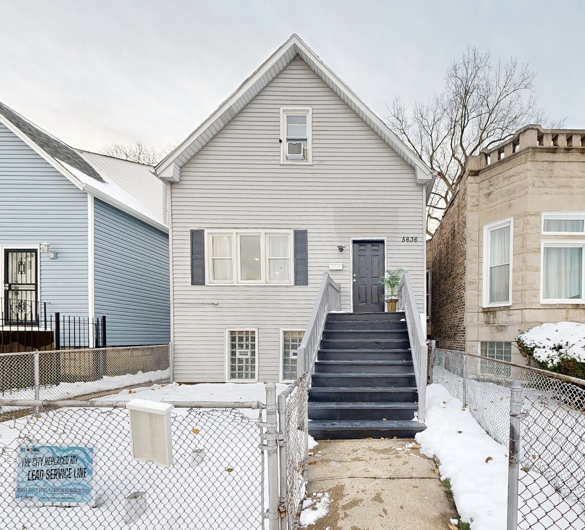 5636 South Carpenter Street Chicago, IL 60621 - Photo 1 of 27 a front view of a house with a yard