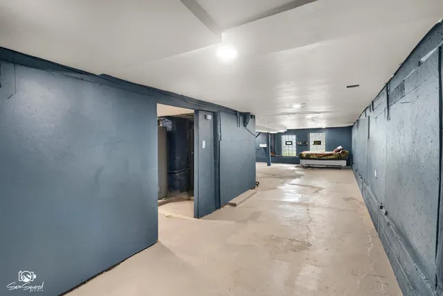 a view of a hallway with kitchen island