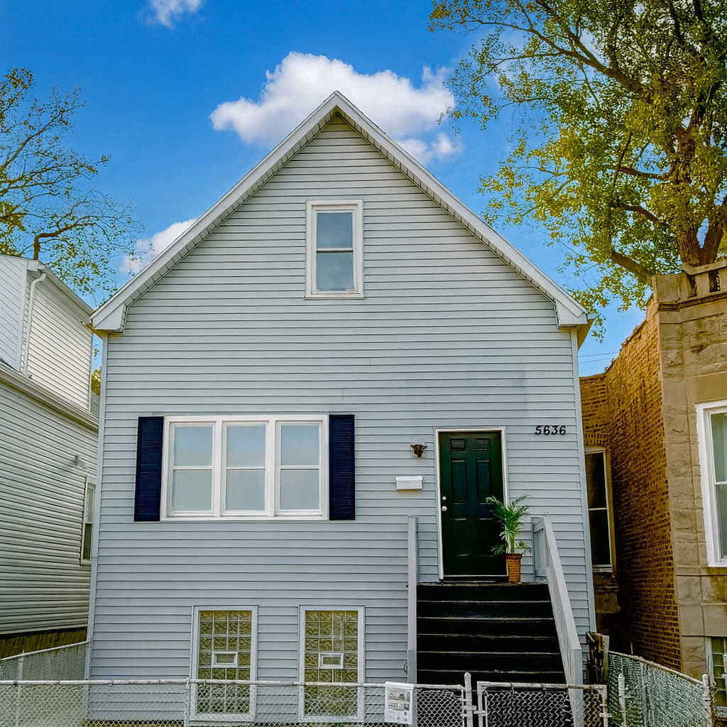 5636 South Carpenter Street Chicago, IL 60621 - Photo 2 of 27 a view of a house with a yard
