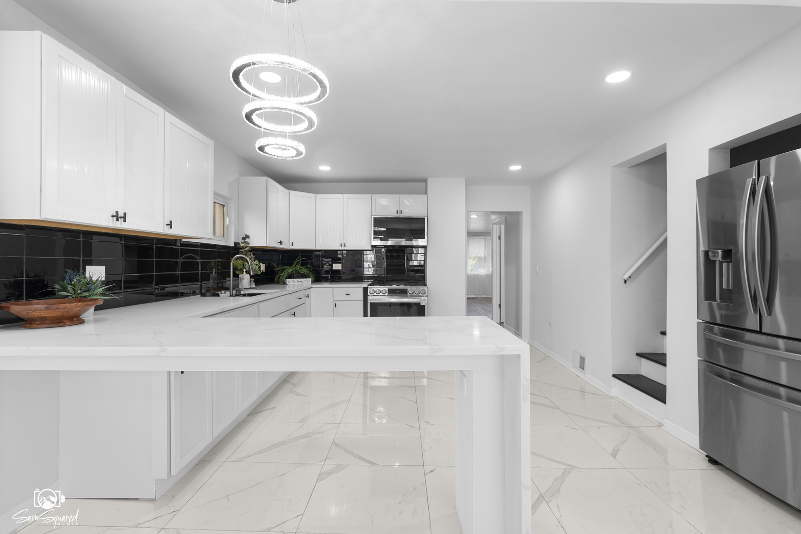 5636 South Carpenter Street Chicago, IL 60621 - Photo 8 of 27 a kitchen with stainless steel appliances granite countertop a refrigerator oven a sink a stove and white cabinets