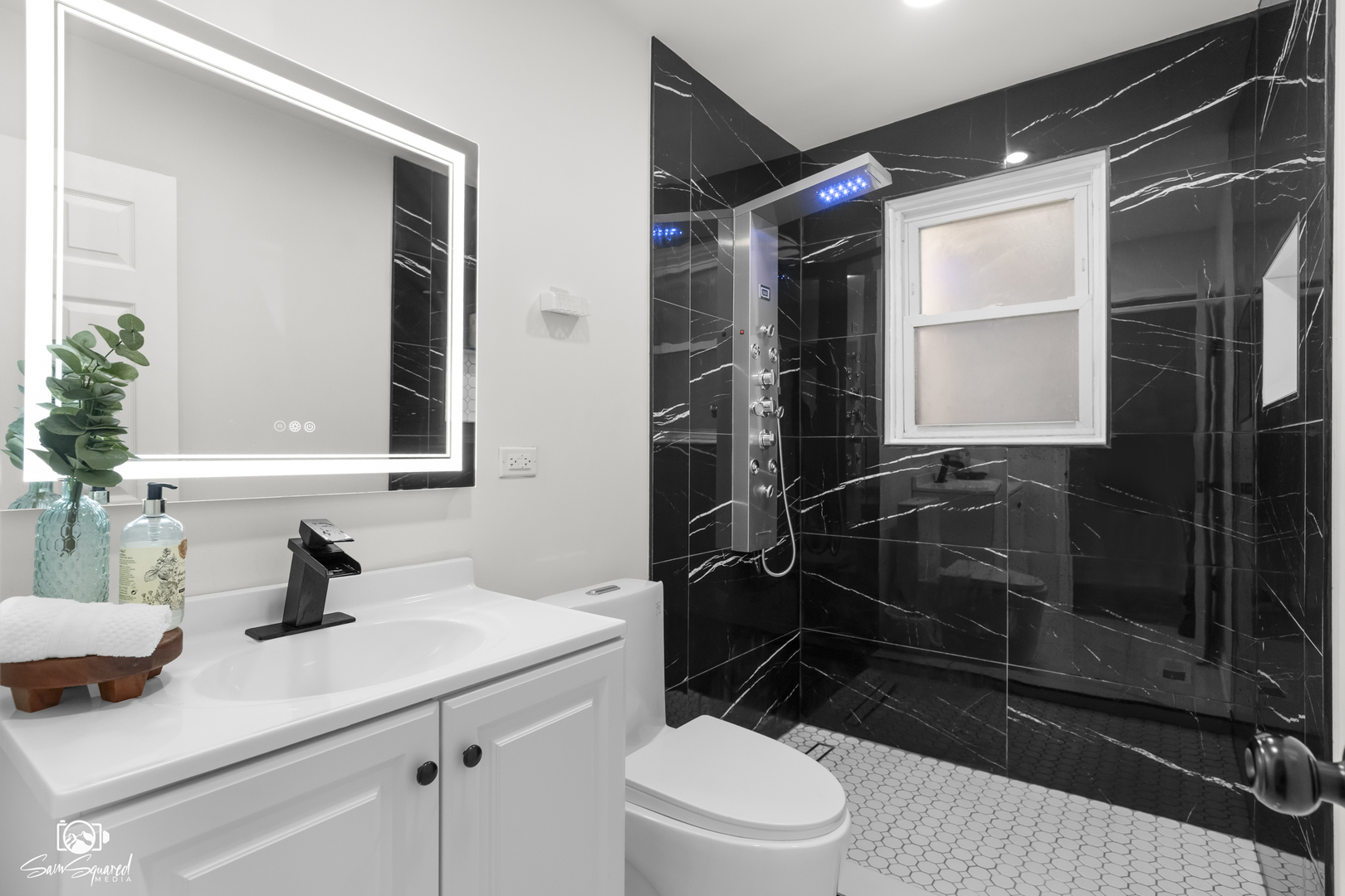 5636 South Carpenter Street Chicago, IL 60621 - Photo 10 of 27 a bathroom with a sink a toilet a window and shower