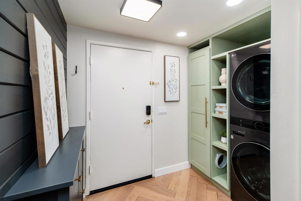 2349 Altisma Way, Unit B Carlsbad, CA 92009 - Photo 4 of 36 a view of walk in closet with clothes and shoes