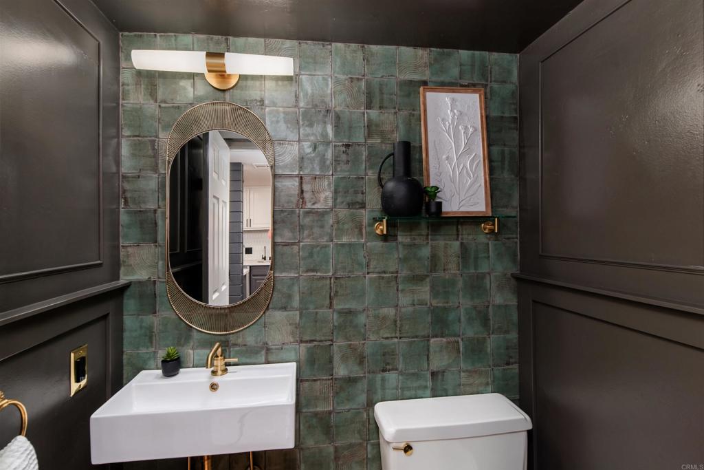 2349 Altisma Way, Unit B Carlsbad, CA 92009 - Photo 6 of 36 a bathroom with a sink mirror and toilet
