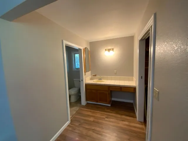 a view of bathroom with mirror and sink