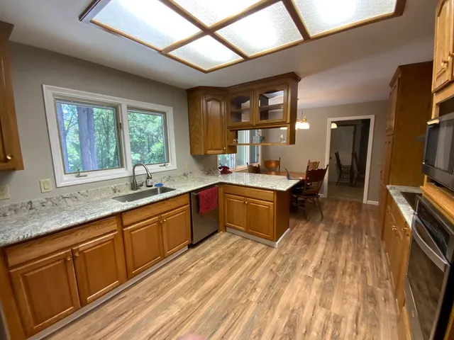 a kitchen with a sink stove and cabinets