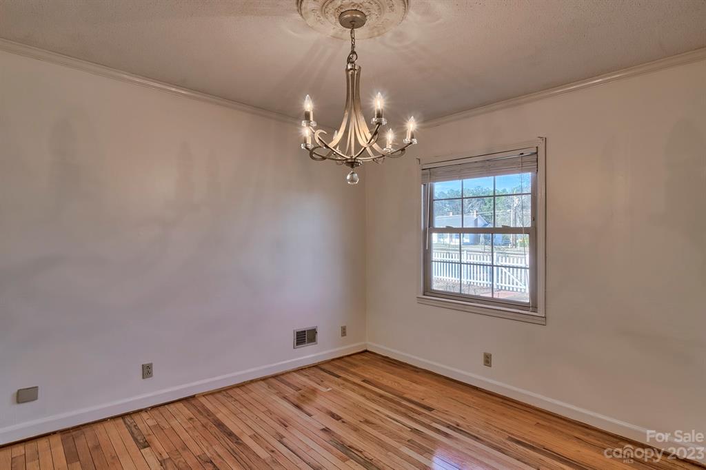 117 State Rd S-29-221 Kershaw, SC 29067 - Photo 12 of 28 a view of empty room with wooden floor and fan