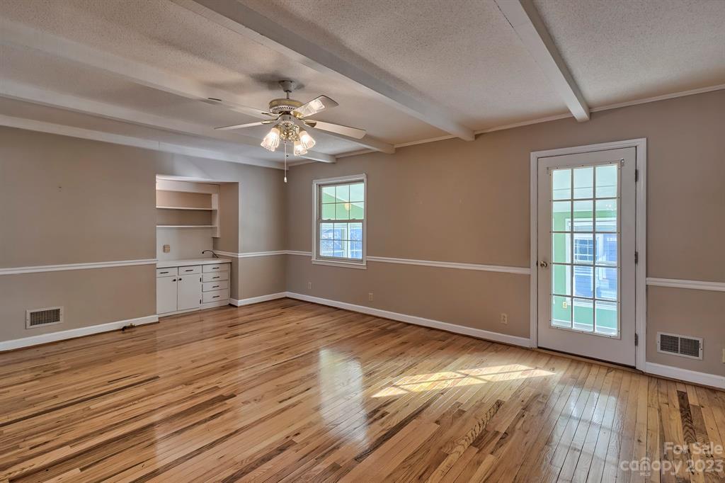117 State Rd S-29-221 Kershaw, SC 29067 - Photo 15 of 28 wooden floor in an empty room with a window