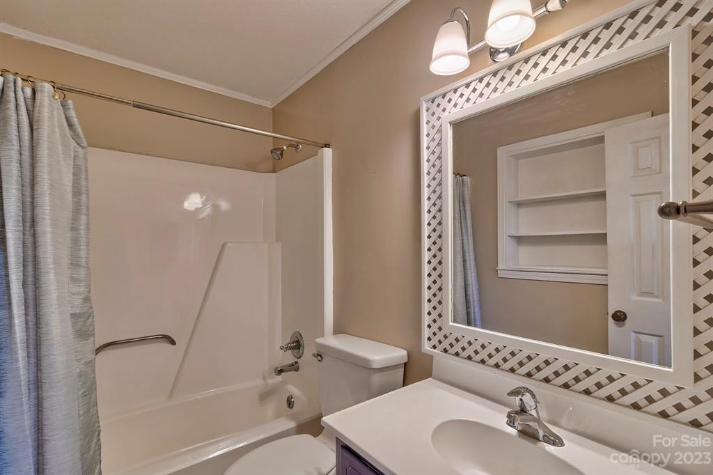 117 State Rd S-29-221 Kershaw, SC 29067 - Photo 21 of 28 a bathroom with a sink a mirror and a shower