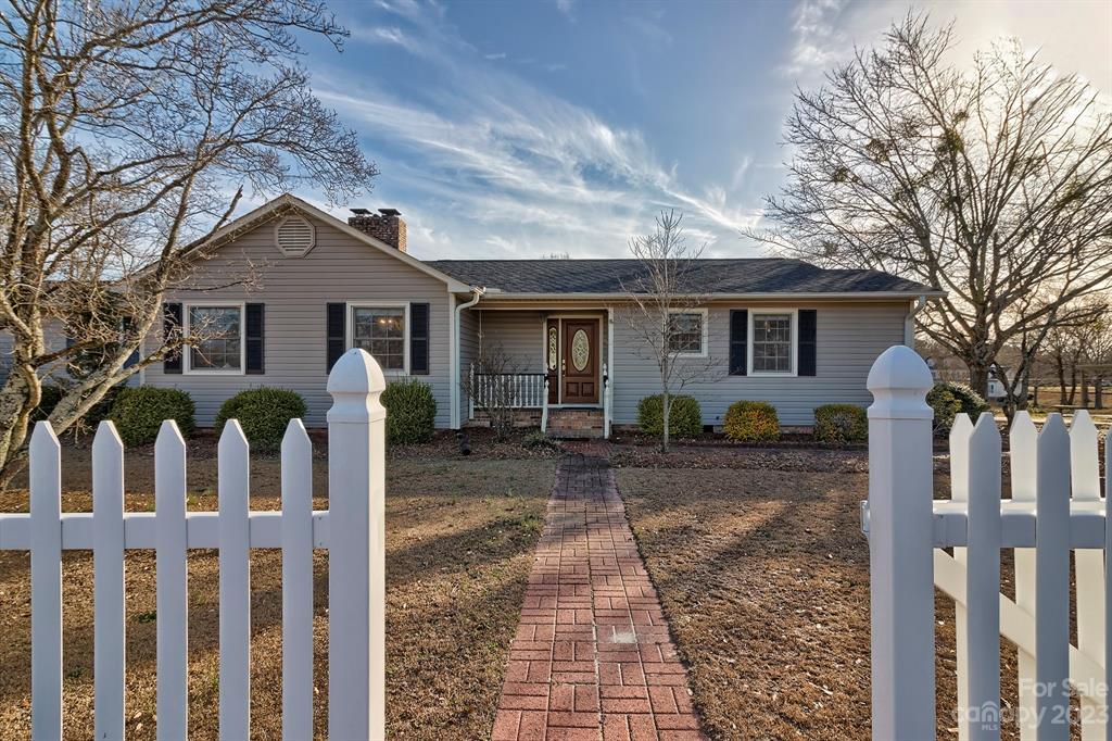 117 State Rd S-29-221 Kershaw, SC 29067 - Photo 3 of 28 a view of a house with wooden fence next to a yard