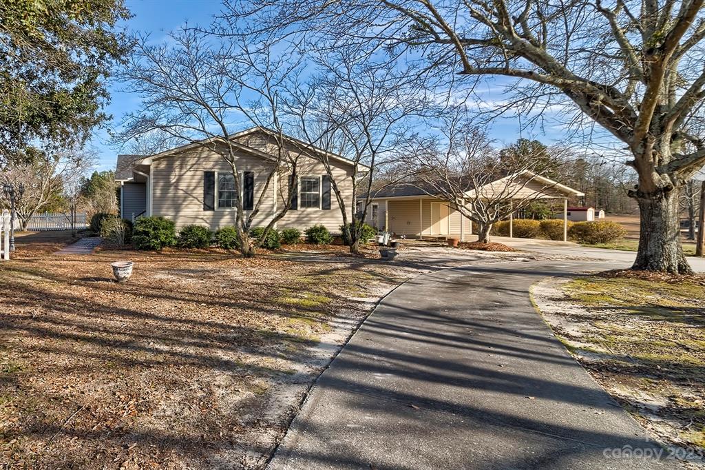 117 State Rd S-29-221 Kershaw, SC 29067 - Photo 5 of 28 a front view of a house with a yard