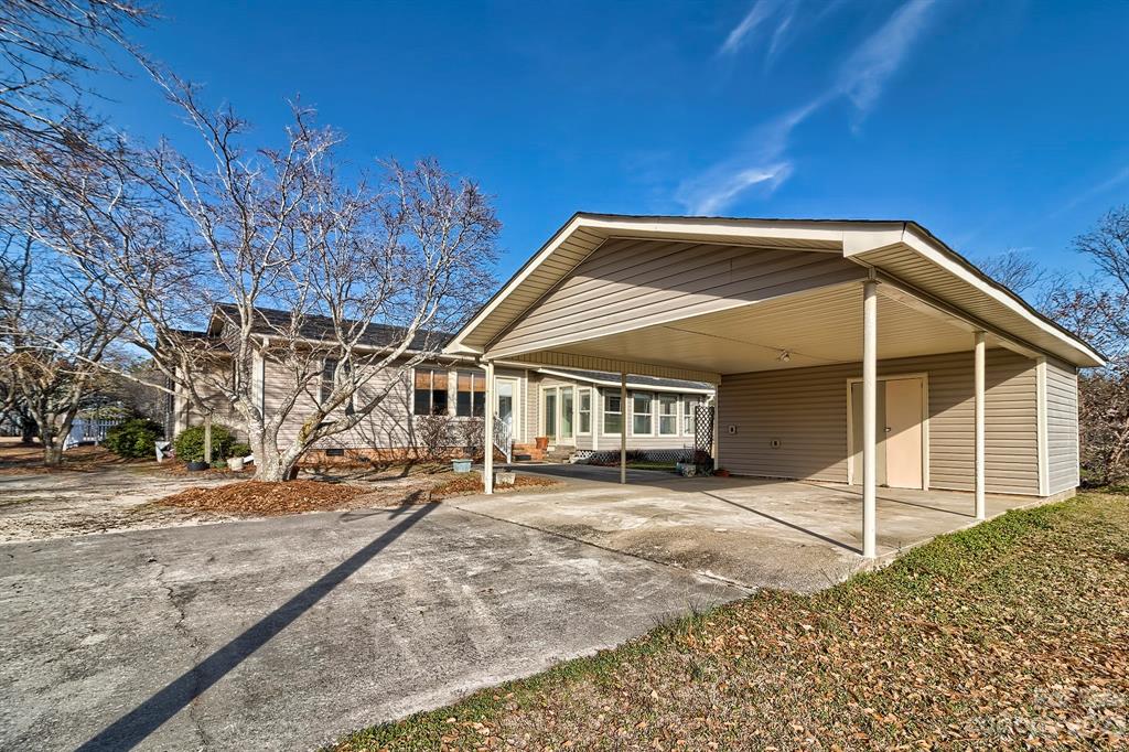 117 State Rd S-29-221 Kershaw, SC 29067 - Photo 6 of 28 a view of a house with a patio