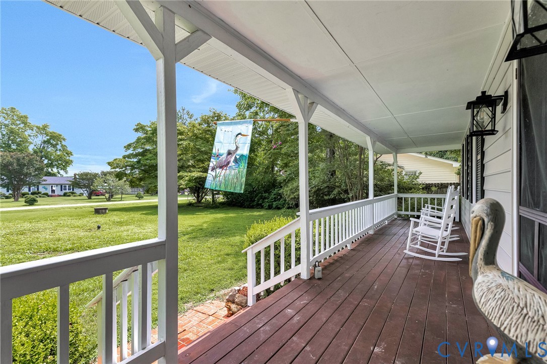 635 River Oaks Road Center Cross, VA 22437 - Photo 12 of 63 Expansive covered front porch with stained wood de