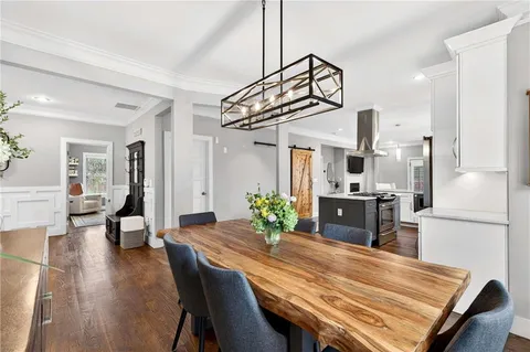 a kitchen with a table and chairs