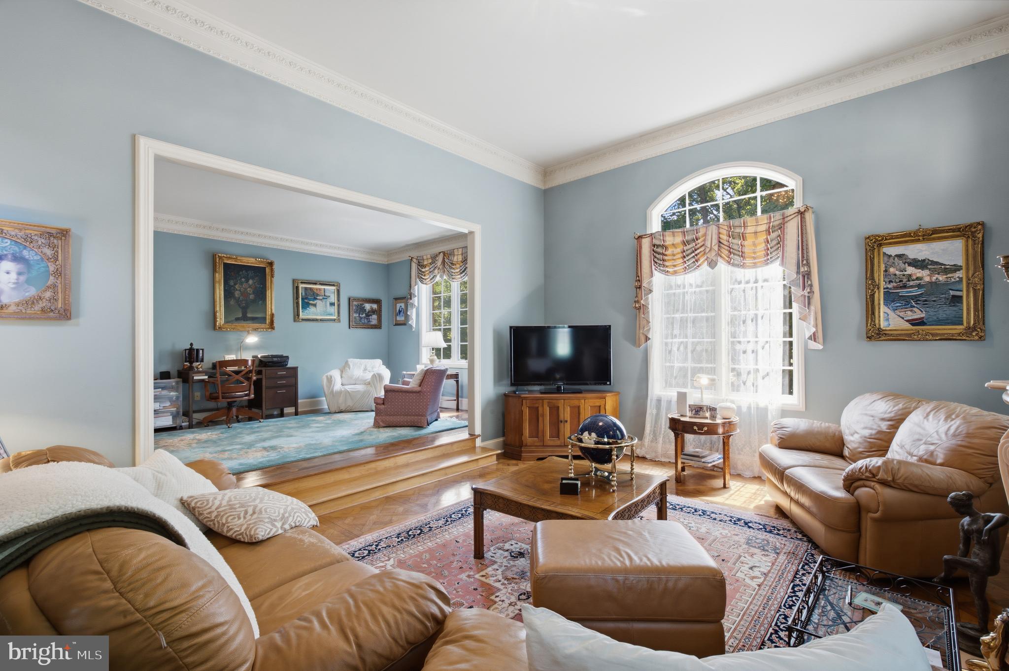1733 Stocton Road Jenkintown, PA 19046 - Photo 27 of 149 a living room with furniture a large window and a flat screen tv
