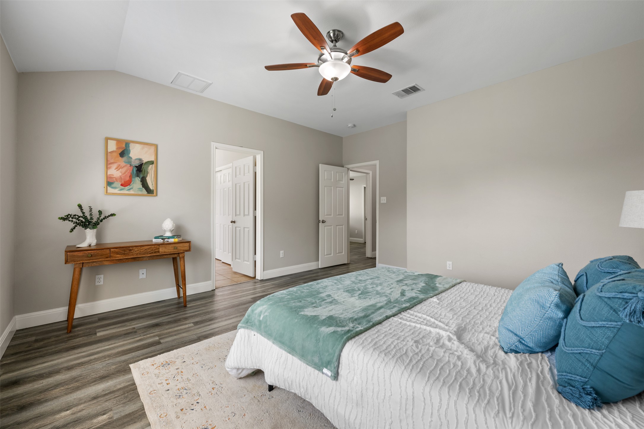 18820 Edinburgh Castle Road Pflugerville, TX 78660 - Photo 25 of 37 a bedroom with a bed and a chandelier