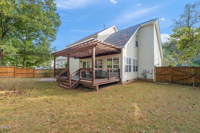 a view of a house with a yard and balcony