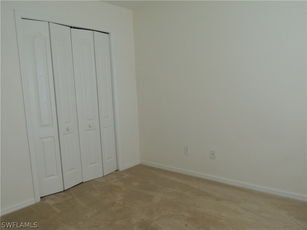 112 Ridgemont Drive Lehigh Acres, FL 33972 - Photo 12 of 18 a view of a closet