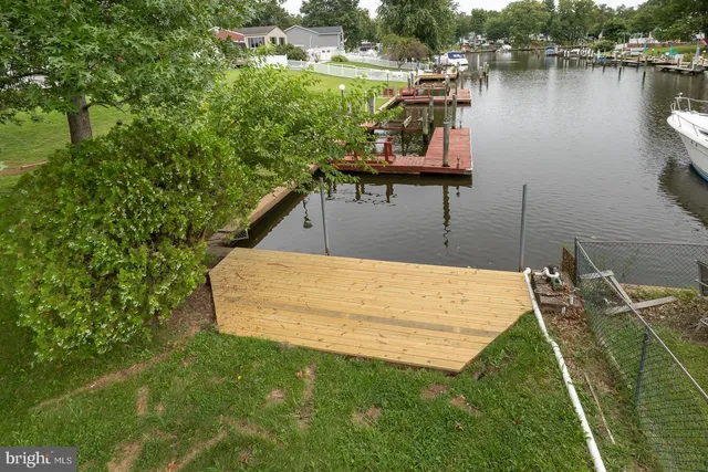 a kitchen with stainless steel appliances granite countertop a refrigerator oven stove a sink and dishwasher