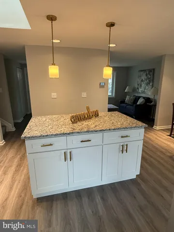 a view of entryway with stairs and wooden floor