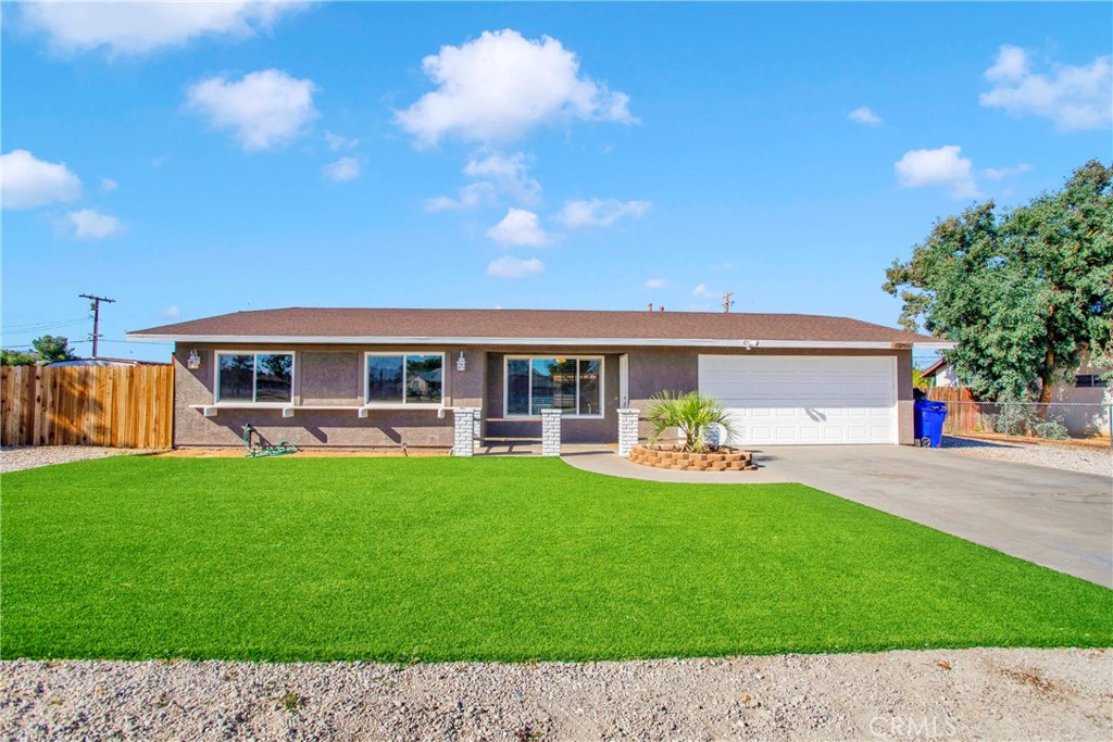 a front view of house with yard and outdoor seating