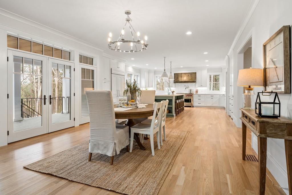5 Stone Ridge Lane Weston, MA 02493 - Photo 14 of 40 a view of a dining room with furniture a chandelier and wooden floor