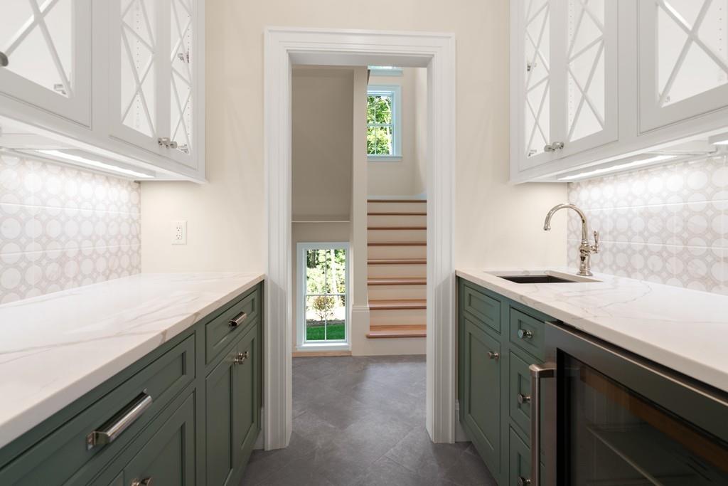 5 Stone Ridge Lane Weston, MA 02493 - Photo 15 of 40 a kitchen with a sink and cabinets