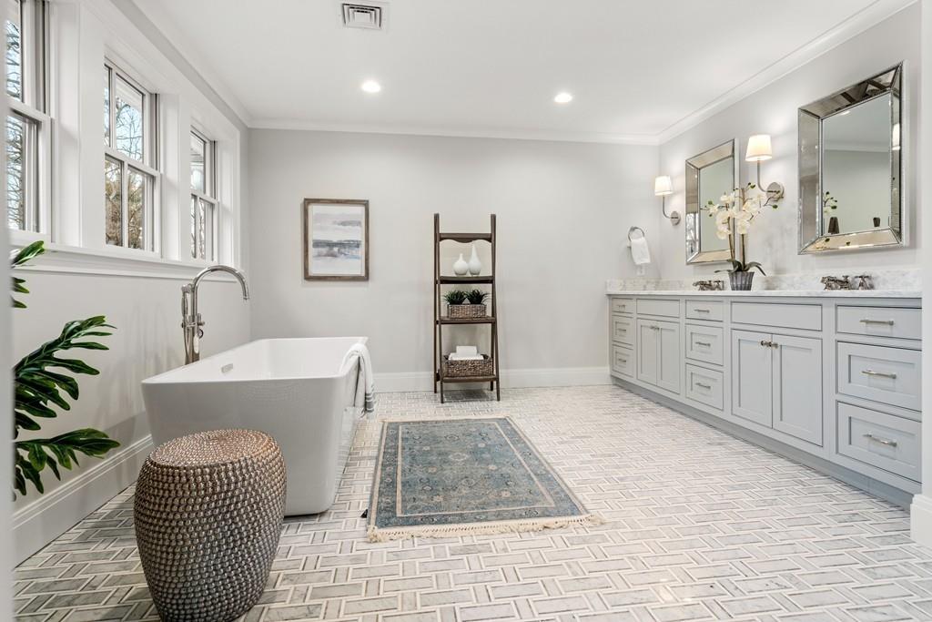 5 Stone Ridge Lane Weston, MA 02493 - Photo 20 of 40 a spacious bathroom with a sink a mirror and a bathtub