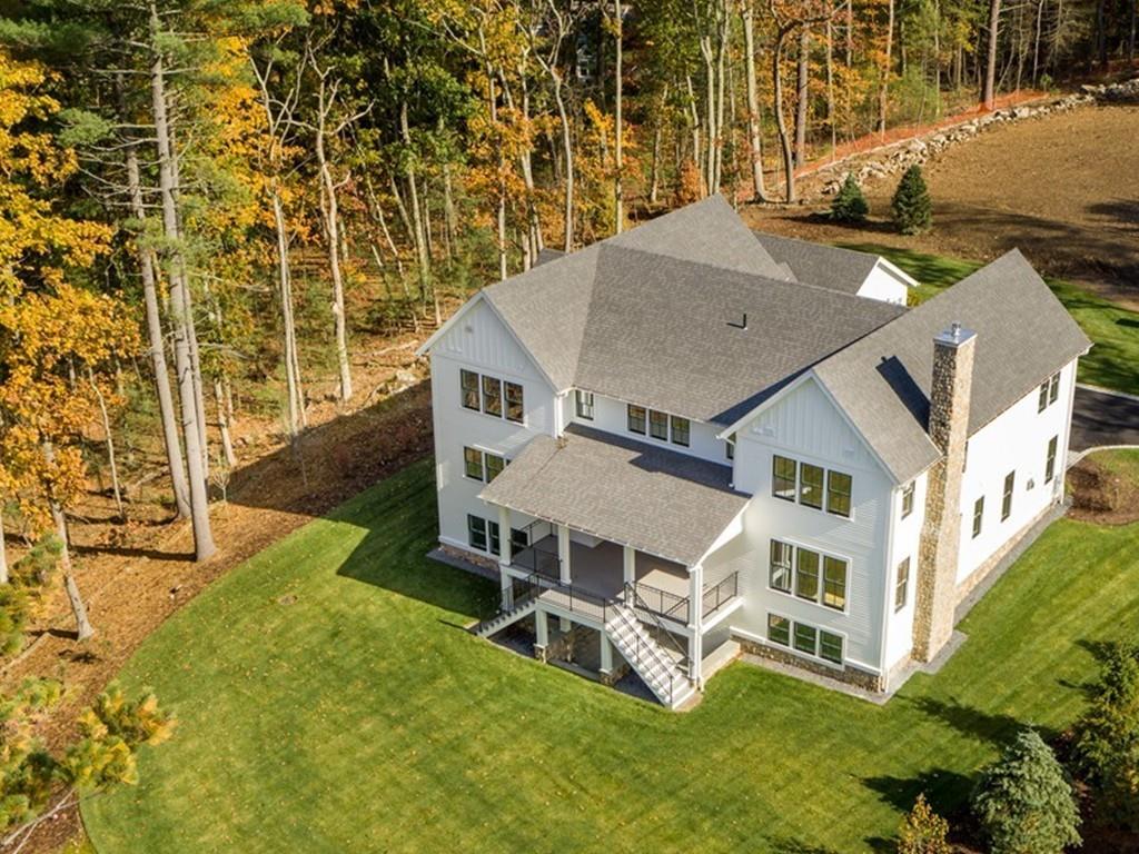 5 Stone Ridge Lane Weston, MA 02493 - Photo 2 of 40 an aerial view of a house with a yard and sitting area