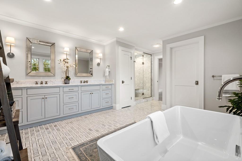 5 Stone Ridge Lane Weston, MA 02493 - Photo 21 of 40 a spacious bathroom with a tub sink and mirror