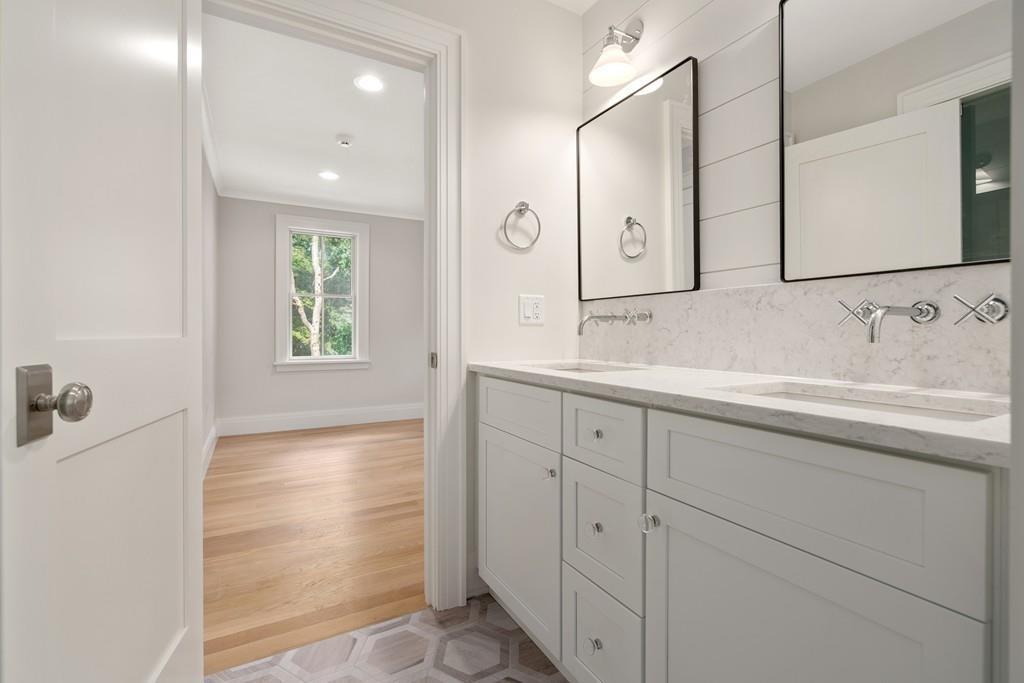 5 Stone Ridge Lane Weston, MA 02493 - Photo 24 of 40 a bathroom with a sink and a mirror