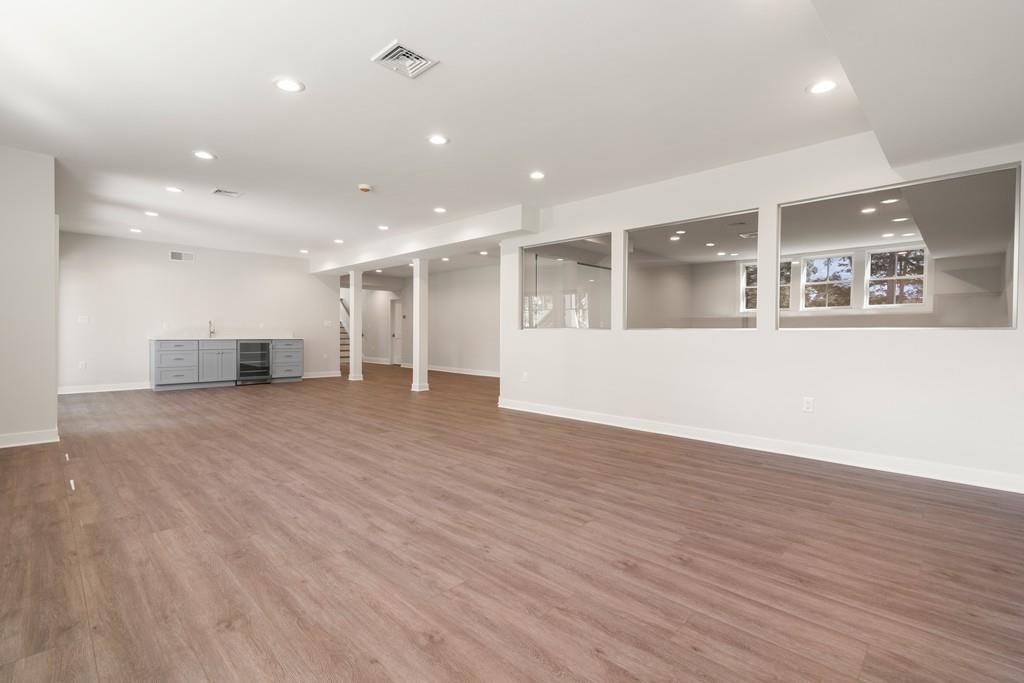 5 Stone Ridge Lane Weston, MA 02493 - Photo 28 of 40 a view of an empty room with wooden floor