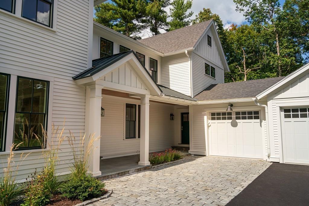 5 Stone Ridge Lane Weston, MA 02493 - Photo 33 of 40 a view of a house with a yard and potted plants