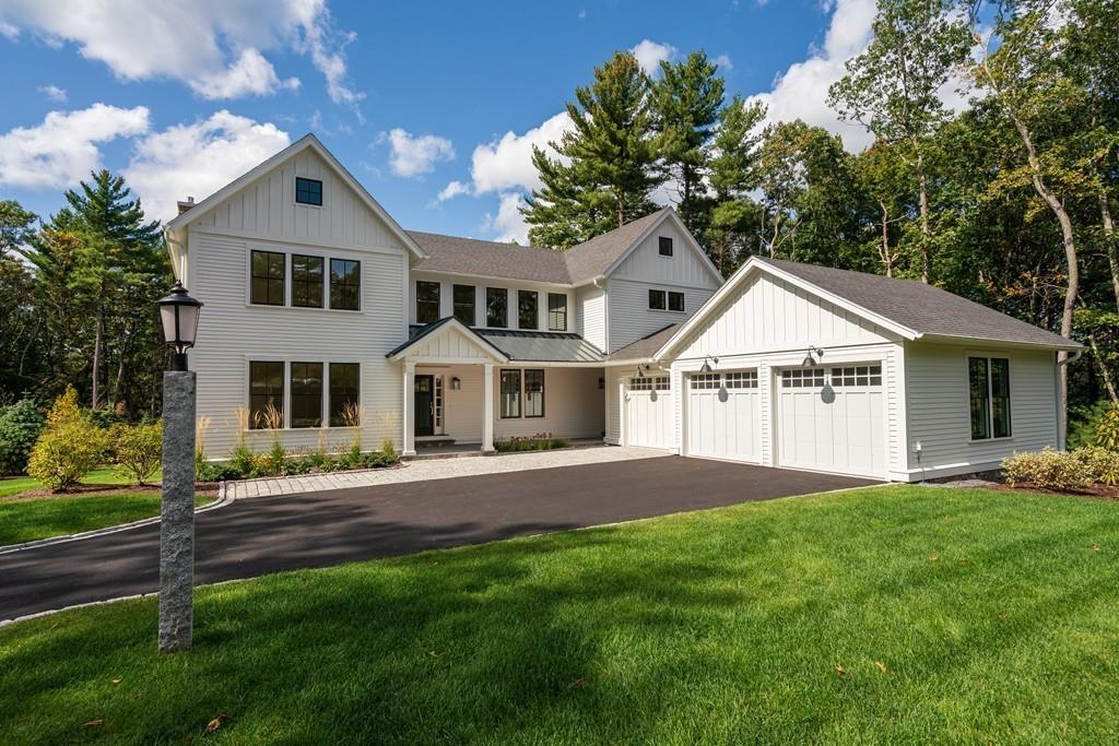 5 Stone Ridge Lane Weston, MA 02493 - Photo 35 of 40 a front view of a house with a garden and yard