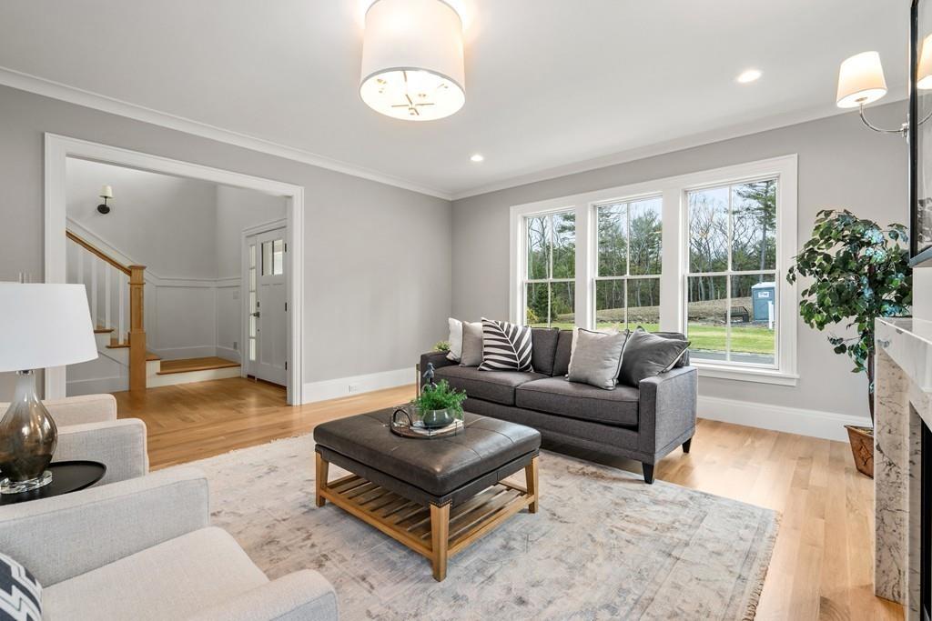 5 Stone Ridge Lane Weston, MA 02493 - Photo 4 of 40 a living room with furniture a table and a large window