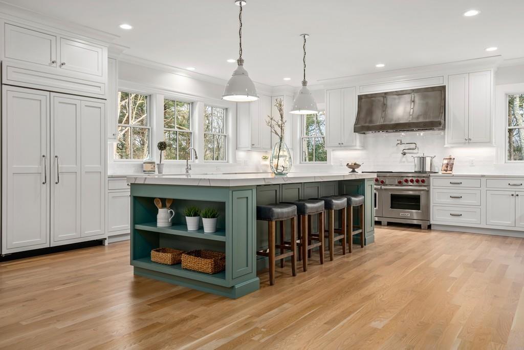 5 Stone Ridge Lane Weston, MA 02493 - Photo 5 of 40 a kitchen with stainless steel appliances granite countertop a stove and a wooden floors