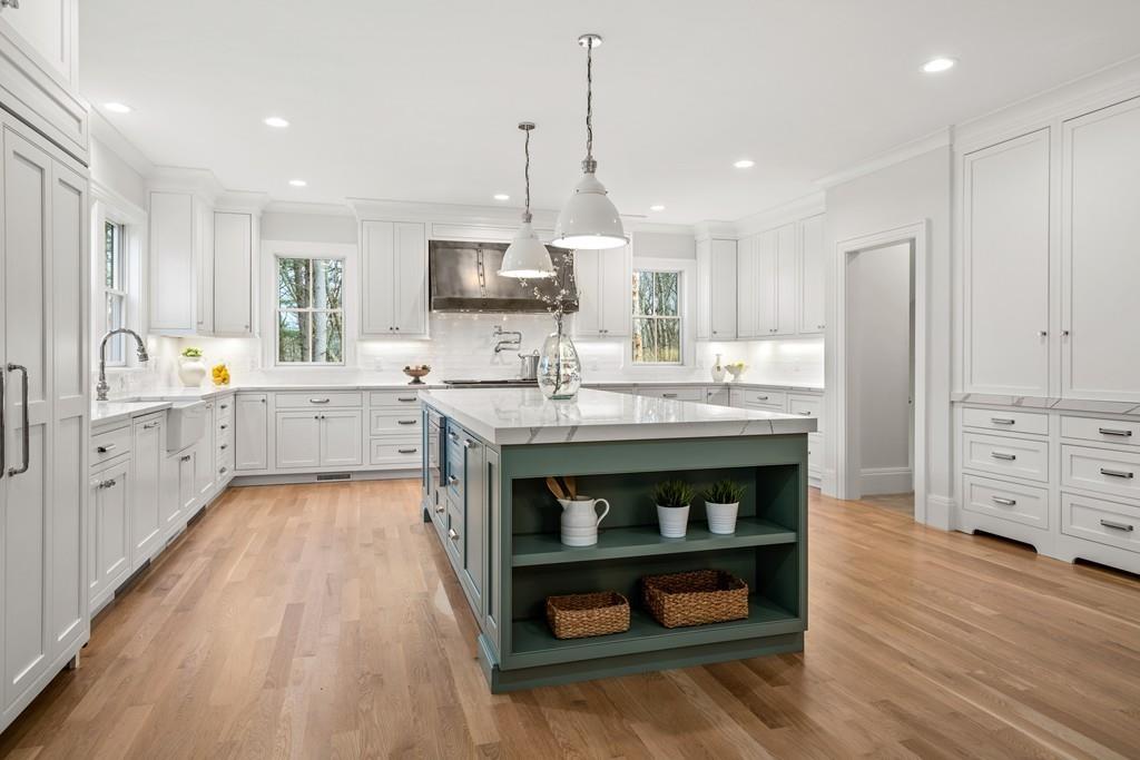 5 Stone Ridge Lane Weston, MA 02493 - Photo 6 of 40 a kitchen with stainless steel appliances granite countertop a sink a stove and a refrigerator